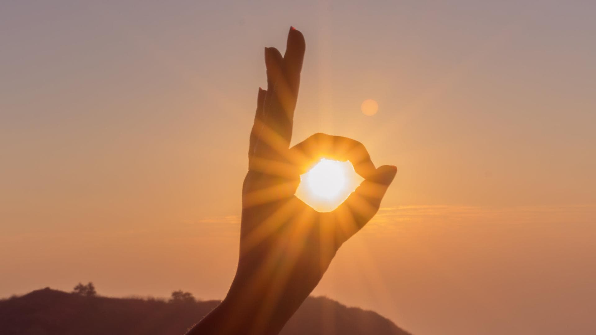 Sonne und Hand