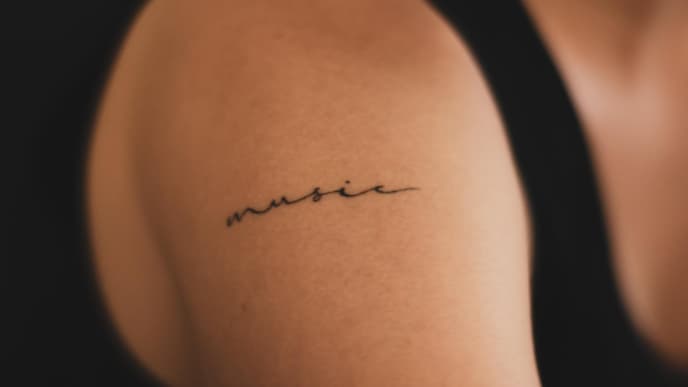 Music Tattoo Schriftzug klein