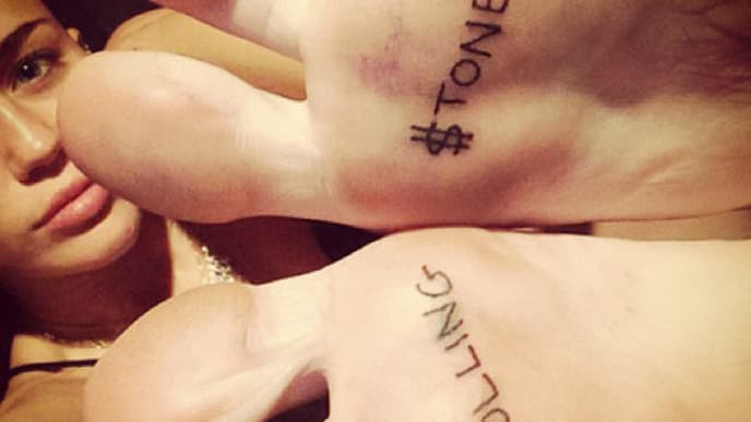 miley-rolling-stone-tattoo-1861076.jpg