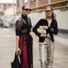Zwei Frauen mit Sonnenbrille auf der Mailänder Fashion Week