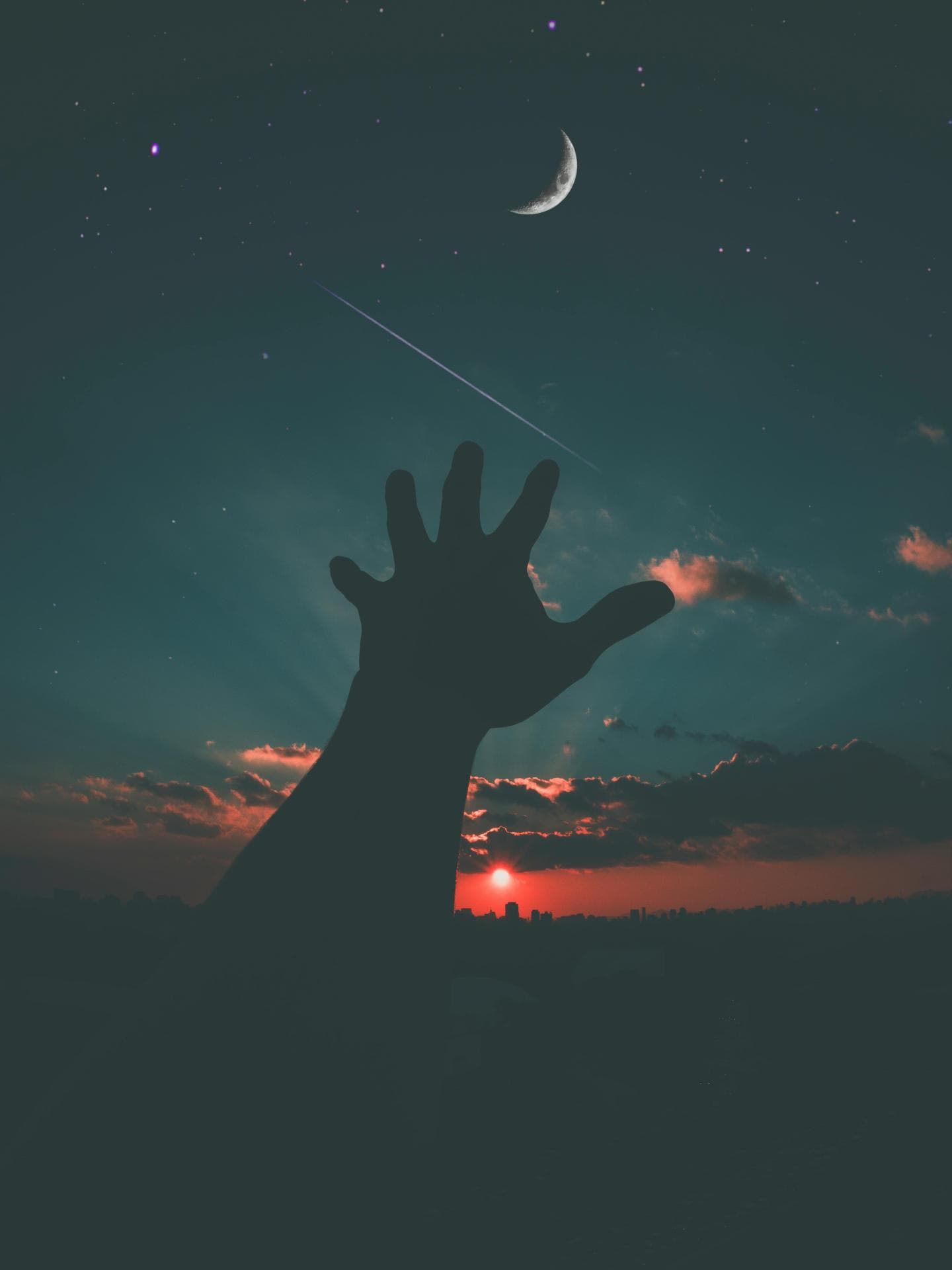 Hand greift nach Mond