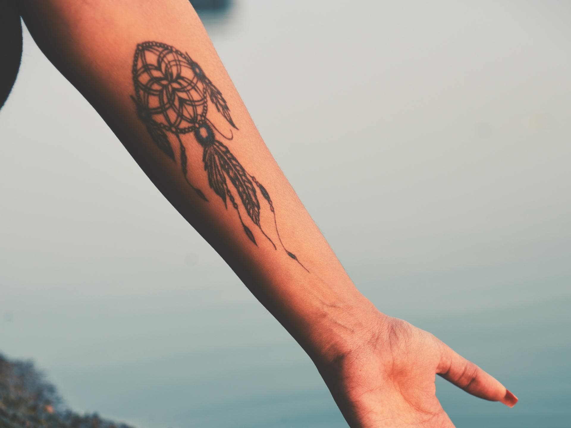 Traumfänger-Tattoo auf Unterarm