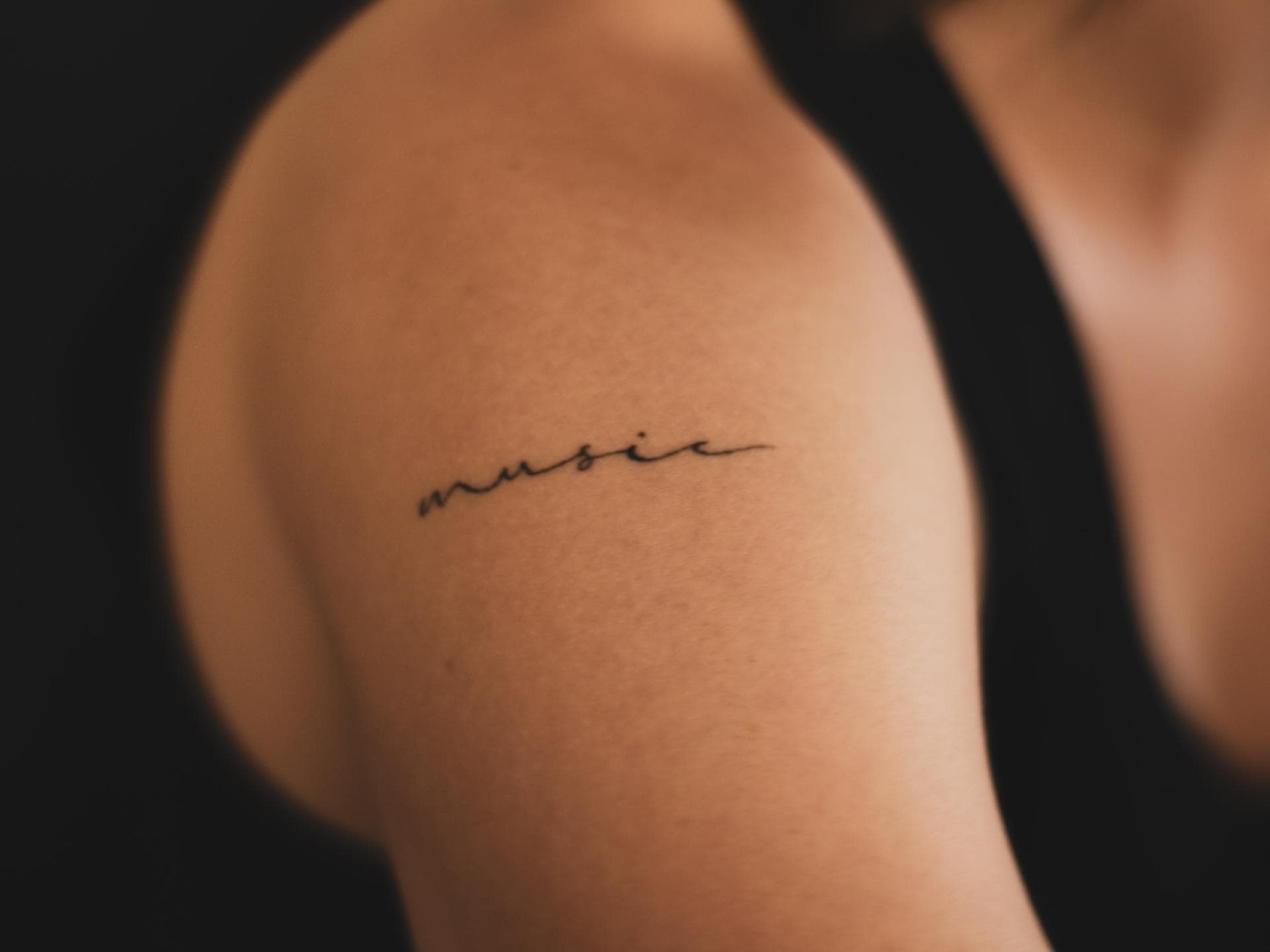 Music Tattoo Schriftzug klein